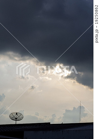Silhouette of satellite dish with black clouds. Silhouette of satellite dish with black clouds. 19250862