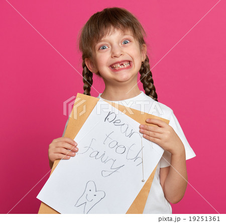 lost tooth girl portrait, studio shoot on pink background lost tooth girl portrait, studio shoot on pink background 19251361