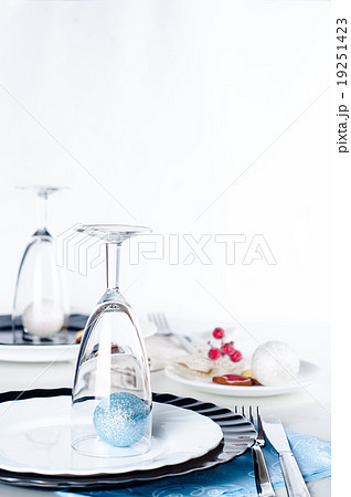 Stylish blue and silver Christmas table setting 19251423