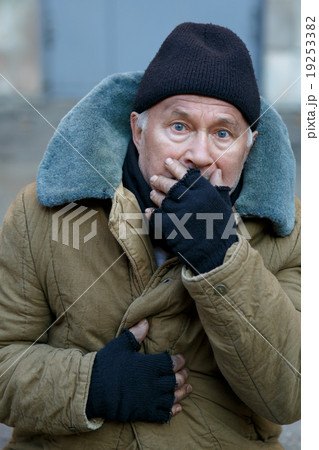 Homeless senior-aged man looks startled an alarmed 19253382