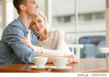 Loving couple sitting in the cafe Loving couple sitting in the cafe 19253420