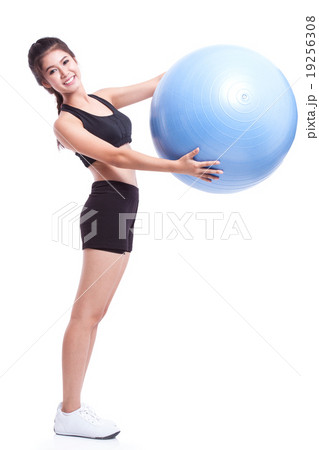 Young woman doing exercises with fitness ball Young woman doing exercises with fitness ball 19256308