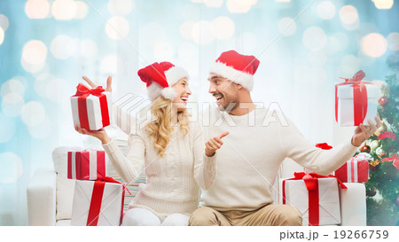 happy couple with christmas gifts and thumbs up happy couple with christmas gifts and thumbs up 19266759