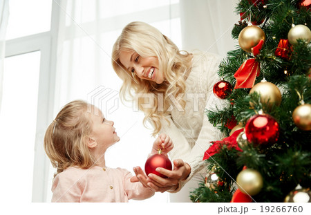 happy family decorating christmas tree at home happy family decorating christmas tree at home 19266760