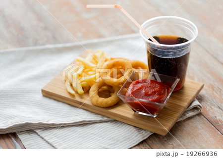 close up of fast food snacks and drink on table 19266936