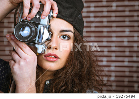 Concept for stylish young woman near brick wall Concept for stylish young woman near brick wall 19275494