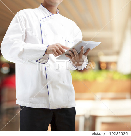 Chef using digital tablet Chef using digital tablet 19282326