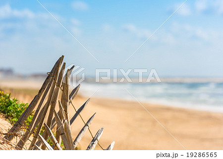 Wooden fence on an Atlantic beach in France Wooden fence on an Atlantic beach in France 19286565