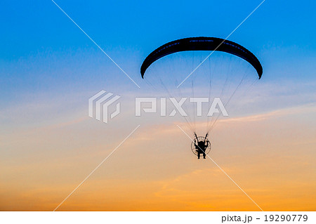 Paramotor flying in the sky Paramotor flying in the sky 19290779