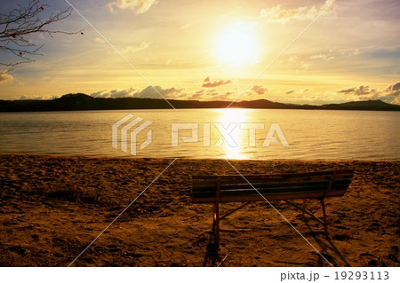 Melancholy evening, bench on autumn beach. Melancholy evening, bench on autumn beach. 19293113