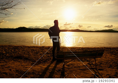 Hiker in sportswear with sporty backpack on beach 19293341