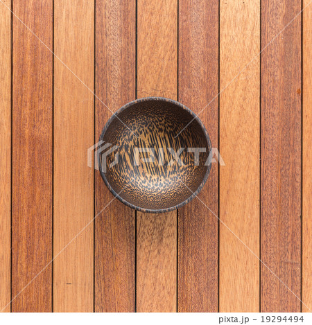 Empty wooden bowl on wooden table 19294494