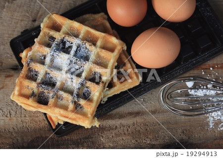 tasty waffle with cooking 19294913