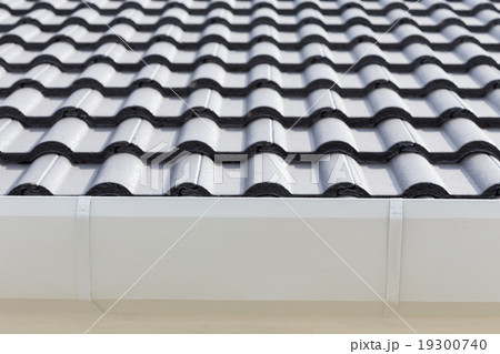 white gutter on the roof top of house white gutter on the roof top of house 19300740