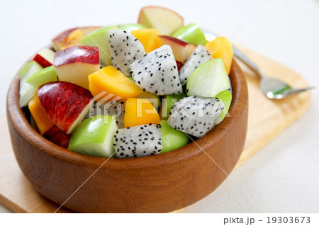 Fruit salad [varietie of fruit salad in a wood bow Fruit salad [varietie of fruit salad in a wood bow 19303673
