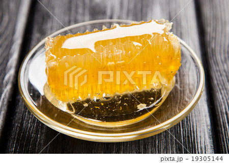 Honeycomb on a glass saucer Honeycomb on a glass saucer 19305144