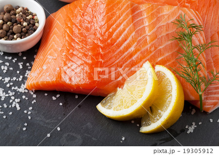 Salmon and spices on stone table Salmon and spices on stone table 19305912