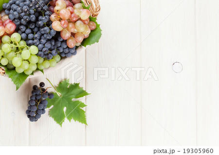 Bunch of red, purple and white grapes in basket 19305960