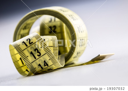 Curved measuring tape. Measuring tape of tailor.  19307032