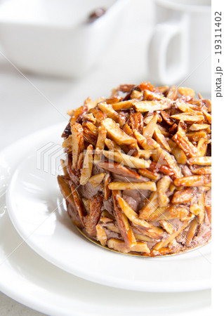 chocolate cake with almond nut on top chocolate cake with almond nut on top 19311402