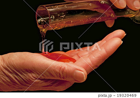 hand with liquid soap 19320469