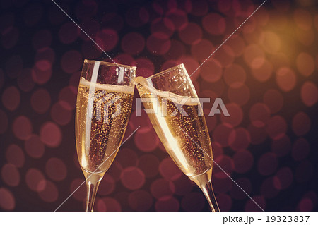 Two elegant champagne glasses making toast 19323837