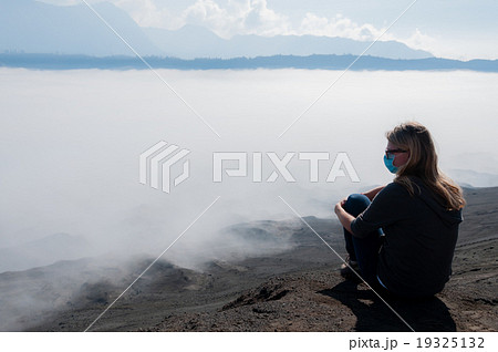 Blond woman Resting at The Mountain Top watching 19325132