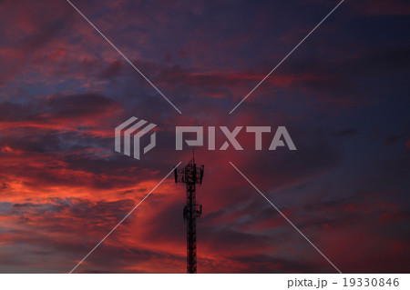 Several radio towers with sunset sky in background Several radio towers with sunset sky in background 19330846
