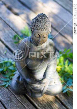 Buddha statue meditating in yoga pose Buddha statue meditating in yoga pose 19333786