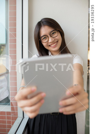 Asian student in library Asian student in library 19336295