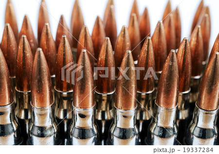 chain of bullets over white, closeup chain of bullets over white, closeup 19337284