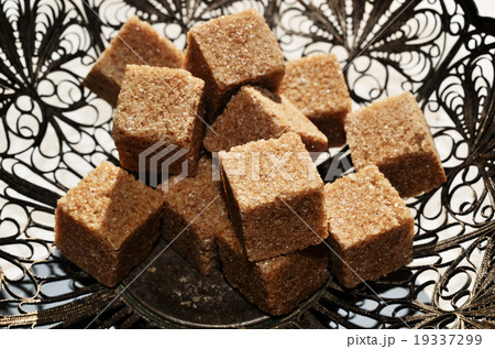 pieces of brown sugar in vintage bowl 19337299