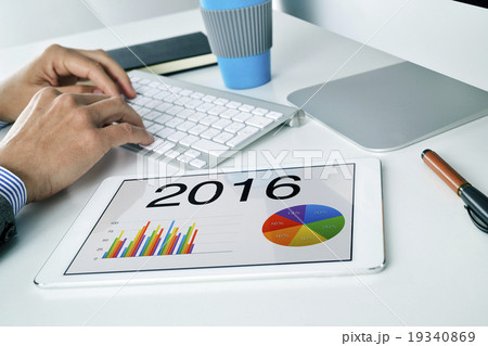man with the forecast for 2016 in his tablet man with the forecast for 2016 in his tablet 19340869