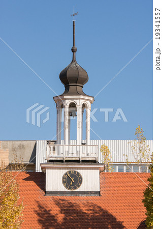 Bell tower with a clock on the building of church 19341557