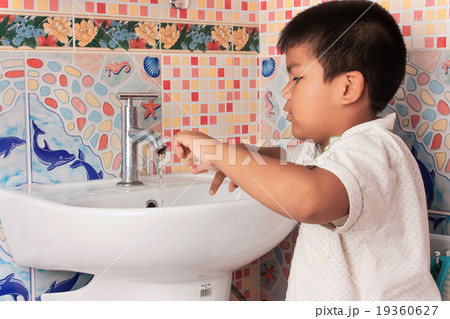 Cute Little Boy washing hand  in the wash room 19360627