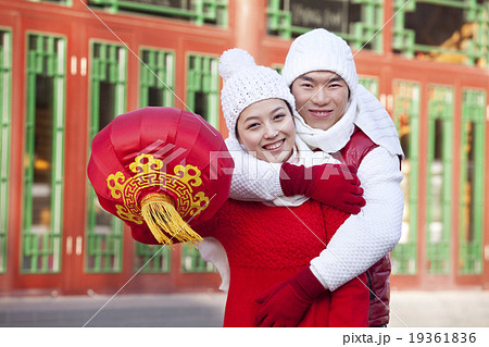 Young couple holding red lantern Young couple holding red lantern 19361836