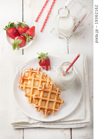 Fresh waffles, bottle of milk Breakfast table Fresh waffles, bottle of milk Breakfast table 19362162
