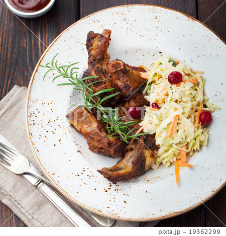 Grilled sliced barbecue pork ribs Salad cole slaw Grilled sliced barbecue pork ribs Salad cole slaw 19362299
