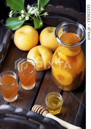 Apricot and cinnamon homemade liquor 19362335