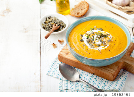 Roasted pumpkin and carrot soup with cream . Roasted pumpkin and carrot soup with cream . 19362465