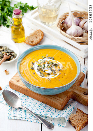 Roasted pumpkin and carrot soup with cream . Roasted pumpkin and carrot soup with cream . 19362558