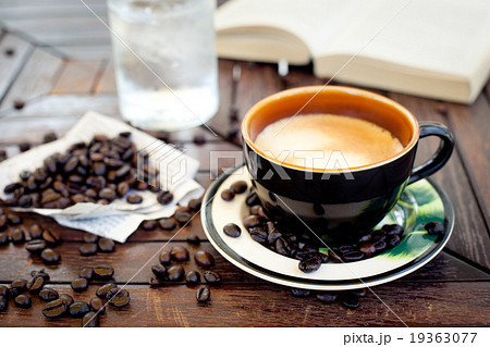 Cup of coffee, cappuccino with beans and a book. Cup of coffee, cappuccino with beans and a book. 19363077