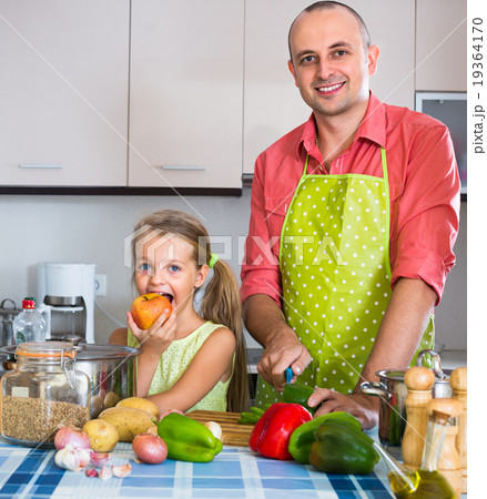 girl helping father to prepare dinner 19364170