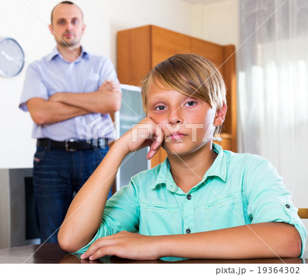 Tired man and frustrated teenager 19364302