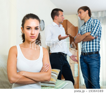 Two young men and unhappy girl 19364389