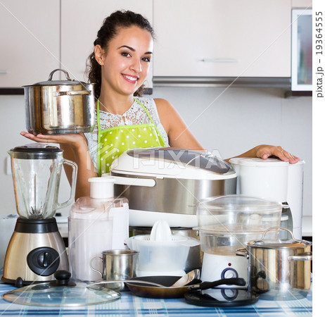 Girl with kitchen appliances at home. Girl with kitchen appliances at home. 19364555