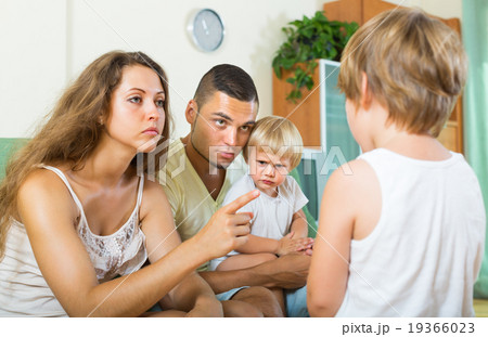 Parents scolding child in home Parents scolding child in home 19366023