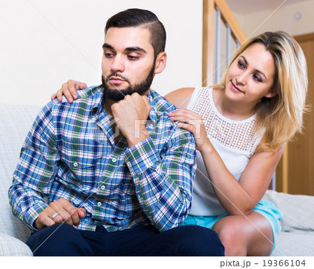 adult asking offended partner for forgiveness at home 19366104