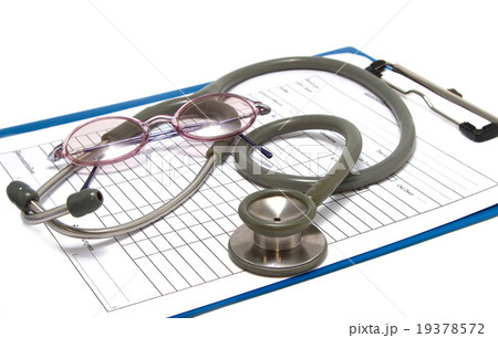 stethoscope and glasses rest on clipboard stethoscope and glasses rest on clipboard 19378572