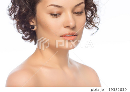 Young attractive woman looks downwards.  19382839